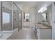 Large bathroom with granite countertops, vanity, glass shower, and jacuzzi tub at 2160 Kensington Gates Nw Dr, Kennesaw, GA 30152