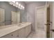 Bathroom with a large mirror, white cabinets, and an open door to the shower area at 2160 Kensington Gates Nw Dr, Kennesaw, GA 30152