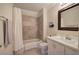 Well-maintained bathroom featuring tile flooring, a shower-tub combination, and a classic white vanity at 2160 Kensington Gates Nw Dr, Kennesaw, GA 30152