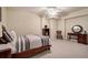 Serene bedroom with neutral decor, a ceiling fan, and a comfortable bed at 2160 Kensington Gates Nw Dr, Kennesaw, GA 30152