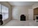 Carpeted room with natural light, neutral paint, and access to hallway at 2160 Kensington Gates Nw Dr, Kennesaw, GA 30152