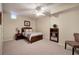 Cozy bedroom with natural light, a ceiling fan, and comfortable carpeting at 2160 Kensington Gates Nw Dr, Kennesaw, GA 30152