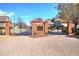 The Gates community entrance featuring brick columns, wrought iron gates, and meticulously landscaped grounds at 2160 Kensington Gates Nw Dr, Kennesaw, GA 30152