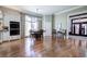 Open dining room with hardwood floors, chandelier, and lots of natural light at 2160 Kensington Gates Nw Dr, Kennesaw, GA 30152