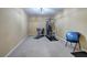 Personal exercise room features gym equipment and ample space at 2160 Kensington Gates Nw Dr, Kennesaw, GA 30152