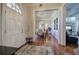 Welcoming foyer with hardwood floors, arched doorway leading to dining room, and a view of the living room at 2160 Kensington Gates Nw Dr, Kennesaw, GA 30152
