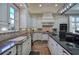 Bright kitchen with custom cabinets, granite countertops, hardwood floors, and stainless steel appliances at 2160 Kensington Gates Nw Dr, Kennesaw, GA 30152