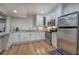 Updated kitchen with stainless steel appliances, granite countertops, and abundant storage space at 2160 Kensington Gates Nw Dr, Kennesaw, GA 30152