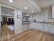 Modern kitchen featuring granite countertops, custom cabinetry, and an open layout at 2160 Kensington Gates Nw Dr, Kennesaw, GA 30152