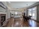 Bright, open kitchen with white cabinetry, stainless appliances, an island, and an adjacent breakfast area with large windows at 2160 Kensington Gates Nw Dr, Kennesaw, GA 30152