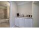 Convenient kitchenette with white cabinets, granite countertops, and stainless steel appliances at 2160 Kensington Gates Nw Dr, Kennesaw, GA 30152