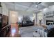 Comfortable living room with fireplace, hardwood flooring, coffered ceiling, and open access to the kitchen at 2160 Kensington Gates Nw Dr, Kennesaw, GA 30152