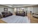 Open-concept living room showcasing hardwood floors, modern decor, and comfortable seating arrangements at 2160 Kensington Gates Nw Dr, Kennesaw, GA 30152