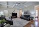 Comfortable living room with coffered ceilings, hardwood floors, and a large television at 2160 Kensington Gates Nw Dr, Kennesaw, GA 30152