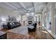 Bright living room with hardwood floors, coffered ceilings, fireplace, and large windows at 2160 Kensington Gates Nw Dr, Kennesaw, GA 30152