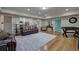 Spacious living room featuring hardwood floors, recessed lighting, and comfortable leather seating at 2160 Kensington Gates Nw Dr, Kennesaw, GA 30152