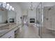 Spa-like main bathroom with separate shower, soaking tub, dual vanities, and fireplace at 2160 Kensington Gates Nw Dr, Kennesaw, GA 30152