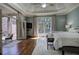 Primary bedroom with hardwood floors, a tray ceiling, French doors and natural light at 2160 Kensington Gates Nw Dr, Kennesaw, GA 30152