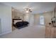 Spacious main bedroom with a ceiling fan, walk-in closet, and direct access to the outside at 2160 Kensington Gates Nw Dr, Kennesaw, GA 30152