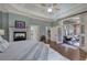 Spacious main bedroom features a fireplace, trey ceilings, and sunroom access at 2160 Kensington Gates Nw Dr, Kennesaw, GA 30152