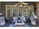 Cozy covered patio provides comfortable seating and an abundance of natural light at 2160 Kensington Gates Nw Dr, Kennesaw, GA 30152
