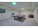 Spacious recreation room featuring a ping pong table and a dart board for hours of fun at 2160 Kensington Gates Nw Dr, Kennesaw, GA 30152