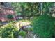 Lush backyard includes rock features and a tranquil water feature at 2160 Kensington Gates Nw Dr, Kennesaw, GA 30152