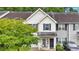 Charming two-story townhome with well-maintained lawn and inviting entrance at 261 Venture Path, Hiram, GA 30141