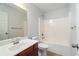 Bathroom with a white vanity, tile flooring, and standard shower-tub combination at 1147 Scenic Park Trl, Lawrenceville, GA 30046