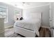 Bedroom with hardwood floors, neutral walls, and white furniture, with a view out the window at 1147 Scenic Park Trl, Lawrenceville, GA 30046