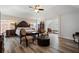 Spacious bedroom with a decorative bed frame, unique seating, and stylish flooring at 1147 Scenic Park Trl, Lawrenceville, GA 30046