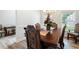 Dining room featuring a wooden table set, stylish chairs, and decorative accents at 1147 Scenic Park Trl, Lawrenceville, GA 30046