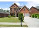 Charming two-story brick home with well-manicured lawn and two-car garage, perfect for Gathering living at 1147 Scenic Park Trl, Lawrenceville, GA 30046