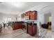 Open kitchen with dark cabinets, stainless steel appliances, and a breakfast nook at 1147 Scenic Park Trl, Lawrenceville, GA 30046