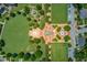 Stunning aerial view of a manicured community park complete with water features, paths, and ample greenery at 260 W Peachtree St, Norcross, GA 30071