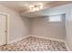 Finished basement room with geometric tile flooring and natural light at 260 W Peachtree St, Norcross, GA 30071