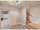 Finished basement with geometric tile floor and access to carpeted stairs at 260 W Peachtree St, Norcross, GA 30071
