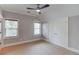 Neutral bedroom with carpet, ceiling fan, two windows, and closet at 260 W Peachtree St, Norcross, GA 30071