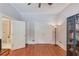 Bedroom with hardwood floors and open bathroom entrance, showing lots of closet space at 260 W Peachtree St, Norcross, GA 30071