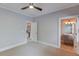 Neutral carpeted bedroom leads to attached bathroom at 260 W Peachtree St, Norcross, GA 30071