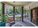 Spacious covered porch with stylish decor, perfect for enjoying the outdoors and neighborhood views at 260 W Peachtree St, Norcross, GA 30071