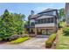Beautiful home with a screened-in porch, deck, attached garage, and landscaped front yard at 260 W Peachtree St, Norcross, GA 30071