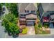 Charming two-story home featuring a screened-in porch, deck, and lush landscaping at 260 W Peachtree St, Norcross, GA 30071