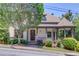 Charming two-story home featuring a welcoming front porch and lush landscaping for enhanced curb appeal at 260 W Peachtree St, Norcross, GA 30071