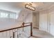 Bright hallway with white trim, a modern light fixture, and natural light from windows at 260 W Peachtree St, Norcross, GA 30071