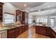 Well-appointed kitchen with cherry cabinets and a view into the dining and living areas at 260 W Peachtree St, Norcross, GA 30071