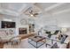 Bright living room featuring a cozy fireplace, built-in shelves, and stylish decor at 260 W Peachtree St, Norcross, GA 30071