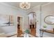 Bright living area showing an open floor plan leading to a kitchen and stairway at 260 W Peachtree St, Norcross, GA 30071