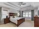 Spacious main bedroom features a tray ceiling, windows, and neutral carpet at 260 W Peachtree St, Norcross, GA 30071