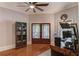 Bright office featuring hardwood floors, a ceiling fan, and double doors at 260 W Peachtree St, Norcross, GA 30071